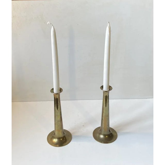 This pair of candlesticks was designed by Hans Bølling and manufactured by Torben Orskov in Denmark during the 1950s. They...