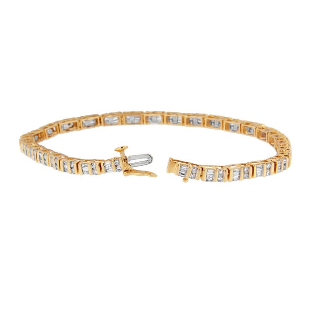 This dazzling tennis style diamond bracelet captivates the tenderness of sweet kisses and hugs. Uniquely designed in a...