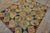 Mid-Century Modern Very Pretty Multi Colored Floral Tumbling Block Pattern Set on a a Light Yellow Tan Background Vintage Signed Sg and Dated 1950 American Hooked Rug For Sale - Image 3 of 15