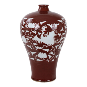 Early 20th-Century Chinese Red-Glazed Vase With Carved White Phoenix and Floral Motifs.