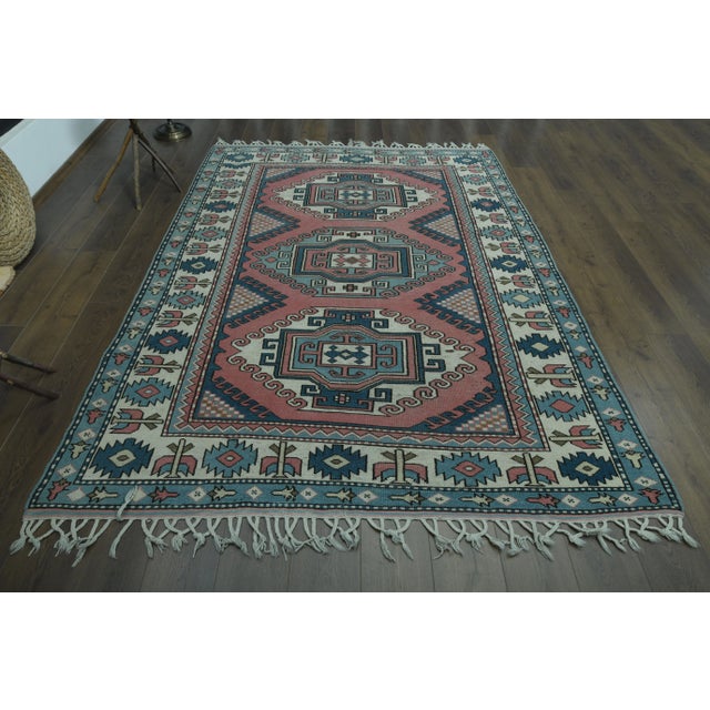 Vintage Turkish Hand-Knotted vintage rug is a semi-antique vintage area rug.'70s Eastern region of Turkey's unique rug is...