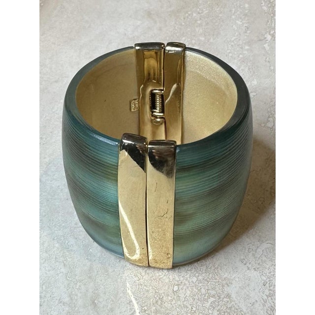 This vintage Alexis Bittar cuff bracelet is a bold, sculptural statement piece, its wide, rounded band crafted from richly...