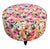 Playful round stool/ottoman upholstered in a vibrant flower, power floral print the colorful fabric captures the spirit of...