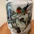 This Chinese hand-painted motif of birds and flowers crackled glaze vase features intricate Foo Dog handles and beautiful...