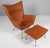 Hans J. Wegner lounge chair / wing chair and ottoman new upholstered with full grain aniline leather. Frame of brushed...