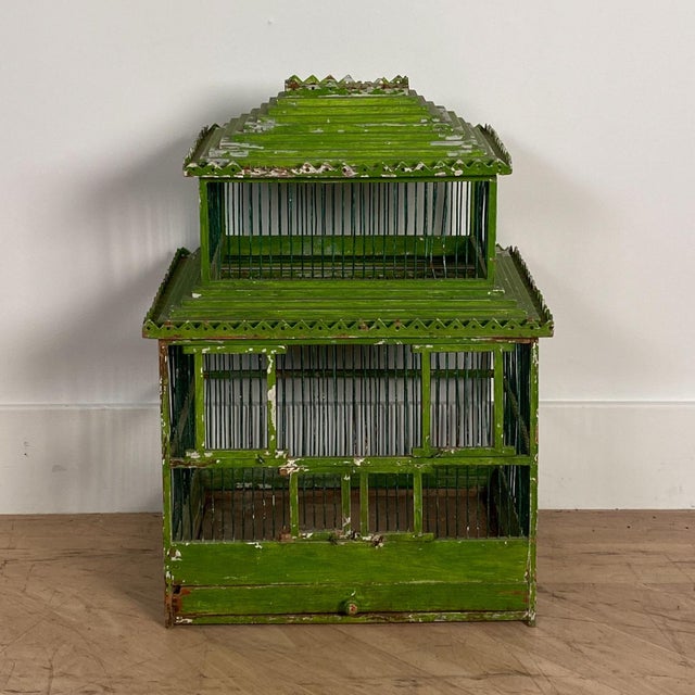 An early 20th-century Southeast Asian green painted bird cage, circa 1900.