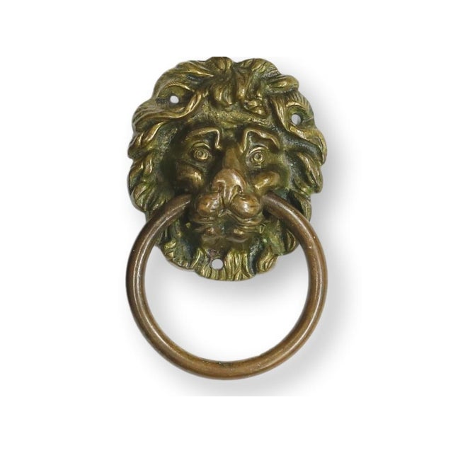 Circa early 1800s, this remarkable set of six lion head drawer pulls showcases beautifully detailed casting. Each pull is...