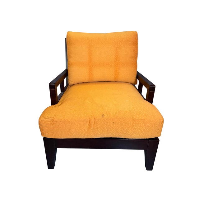 Set of three: a pair of lounge chairs and a matching ottoman with dark-stained wood frames, window-grid arm panels and...