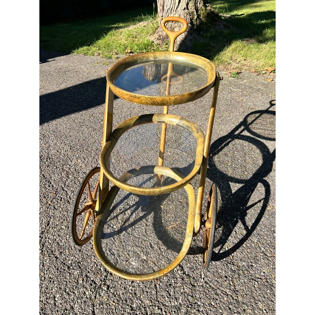 An exceptionally rare and sculptural three-tier rolling bar or serving cart designed by Aldo Tura and produced in Italy...