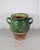 A product of French provincial pottery, this confit pot was made around 1840 and carries a green glaze across its upper...