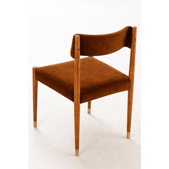 A refined set of four teak dining chairs attributed to Danish designer Aksel Bender Madsen during the 1960s. Defined by...