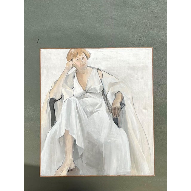 This striking vintage oil on canvas portrait captures the quiet elegance and emotional depth of a seated woman rendered...