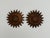 A pair of vintage Spanish wall lamps in aged bronze/copper metal. The sunburst design features multiple concentric, petal...