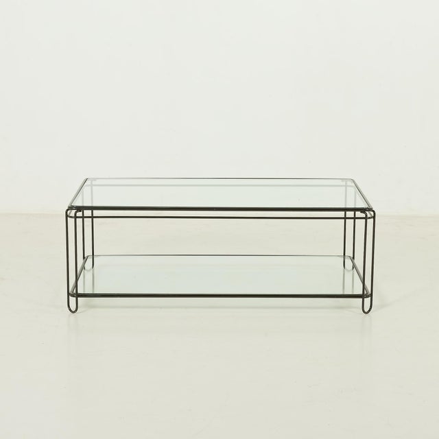 This Italian mid-century coffee table comes from the 1970s and is a sleek and functional piece that embodies the lightness...