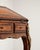 An elegant Louis XV secretary desk combining decorative styling with practical storage. Featuring refined curves and brass...