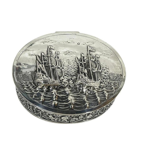 Dutch silver decorative box with scene of the two 17th-century dutch flagships, 1926 a silver biscuit tin or decorative...