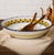 The Stratificata Large Serving Bowl brings the artistry and character of traditional Deruta ceramics to a generous,...