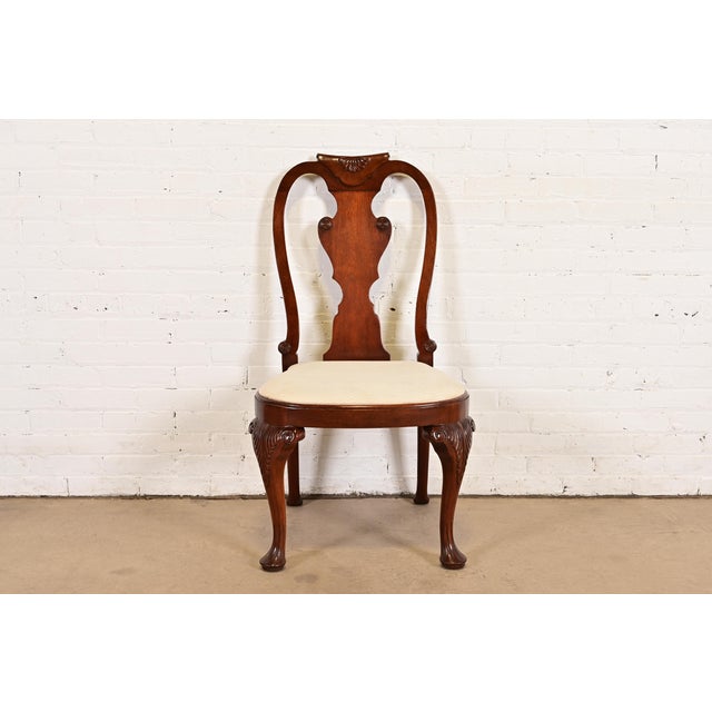 A gorgeous Queen Anne or Georgian style side chair or dining chair By Baker Furniture USA, Circa 1980s Solid carved...