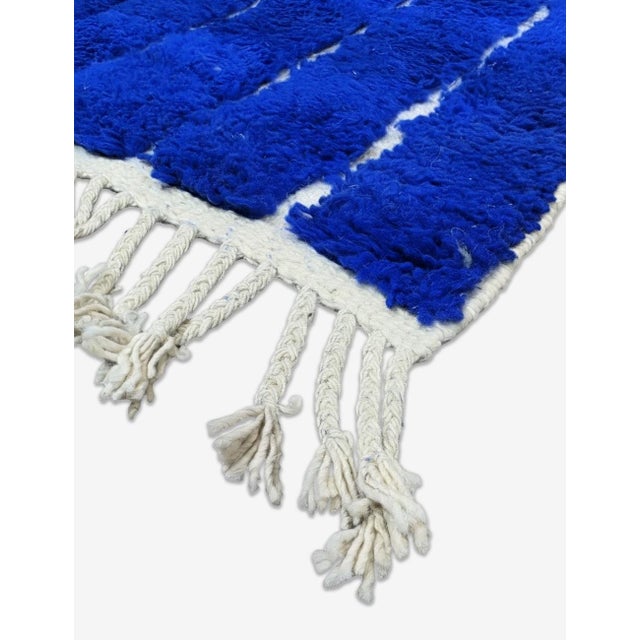 Contemporary Moroccan Rug | Handwoven Sheep Wool Rug with Royal Blue Field and White Maze Linework This bold contemporary...