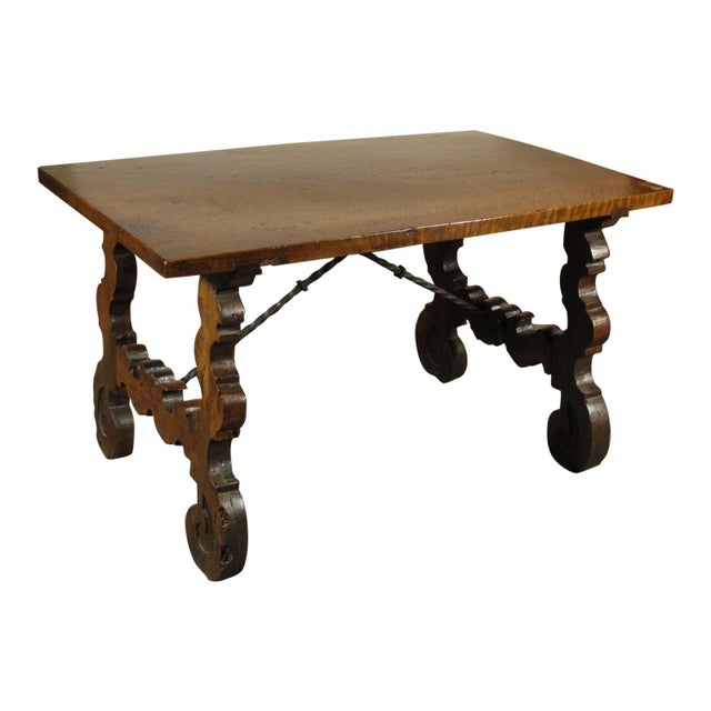 A 17th-C. Spanish Baroque walnut low table with iron stretcher base, hand carved legs and one board top.
