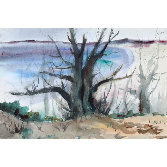 Rising out of the sand at the water's edge, the barren tree in this Eve Nethercott watercolor exudes tranquility and calm....