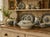 A beautifully aged antique covered dish in classic blueish gray‑and‑white transfer style, featuring scrolling florals,...