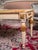 Hand-carved solid beech table in the classicist Louis XVI style with a top made of natural onyx, the top onyx top is...