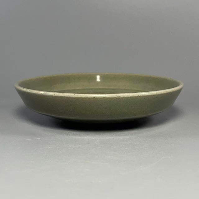 This exceptional 13th-14th century Yuan Dynasty (1271–1368 CE) Longquan celadon shallow dish is a museum-worthy example of...
