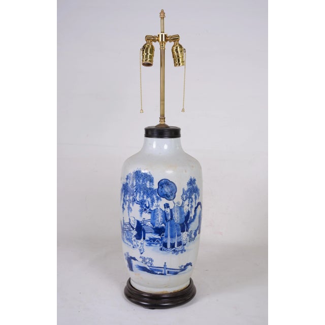 Chinese antique blue and white vase table lamp.SIZE: 9" * 33" People playing in the garden, Chinese characters in the back...