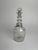 This 19th-century glass decanter, with its distinctive three-ring neck and finely etched vine decoration, is a beautiful...
