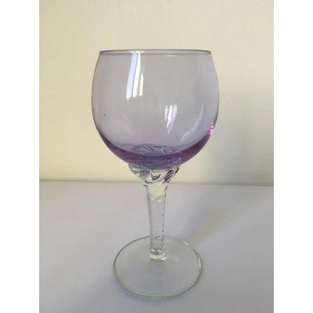 This is an elegant goblet hand made in Murano, Venice in 1960 in Murano blown glass. The piece is very charming and on it...