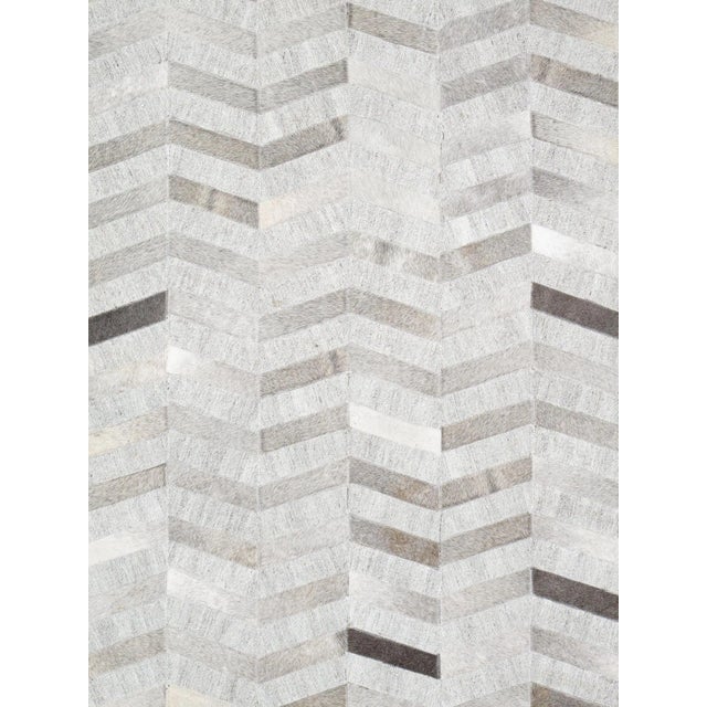 Hand stitched by skilled artisans. A fresh take on a classic geometric, these rugs are hand-stitched cowhide with hand-...