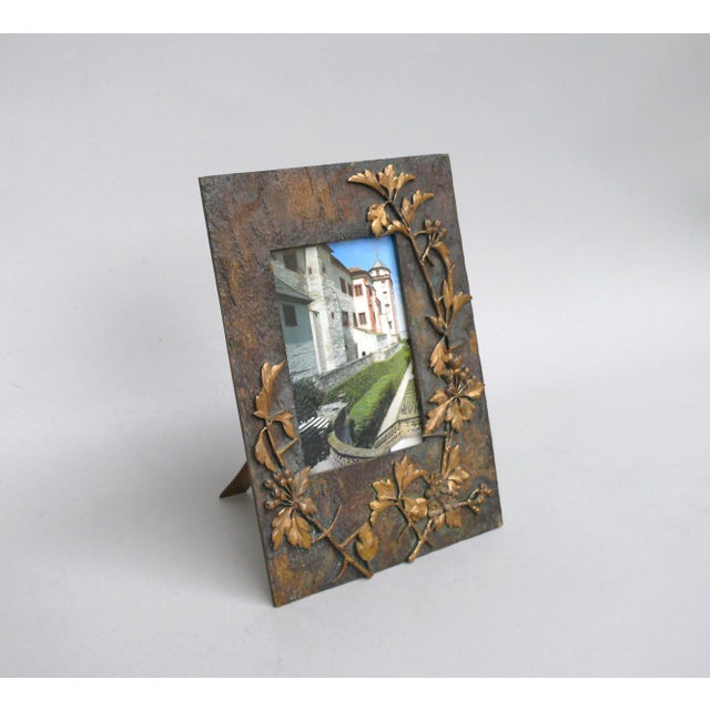 An exceptional picture frame, made in France during the Art Nouveau period. It is marked "M Paris". The frame is crafted...