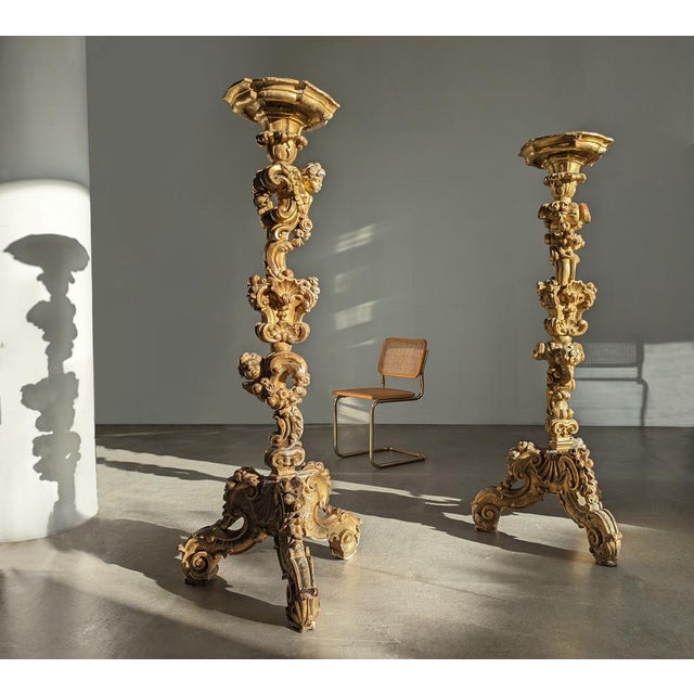 This impressive couple of Italian Torcheres of the nineteenth century are a sublime work of European Baroque art. Carved...