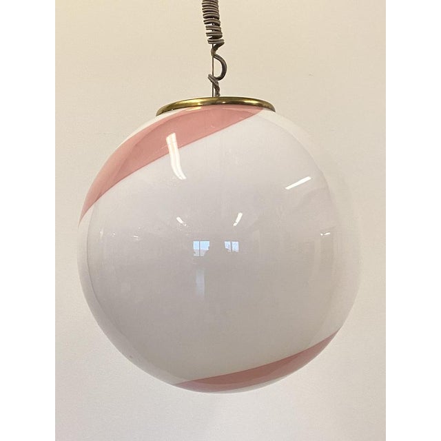 70s chandelier in white and pink murano glass, brass structure. Up to 250V (Europe/UK Standard).The wiring of this item...