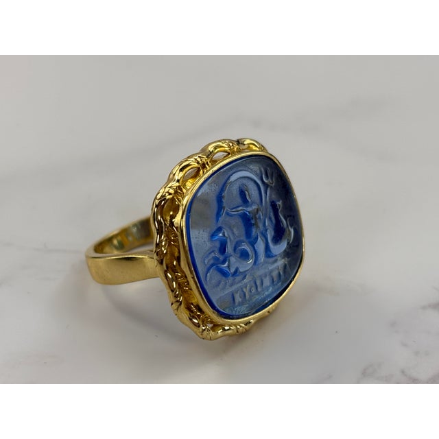 This striking Tagliamonte statement ring features a detailed blue Venetian glass intaglio of Poseidon, set in 925 sterling...