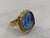 This striking Tagliamonte statement ring features a detailed blue Venetian glass intaglio of Poseidon, set in 925 sterling...