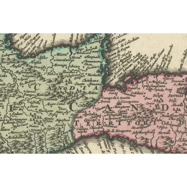 This fine 1749 map titled 'Insula Creta hodie Candia' presents an 18th-century cartographic portrait of the island of...