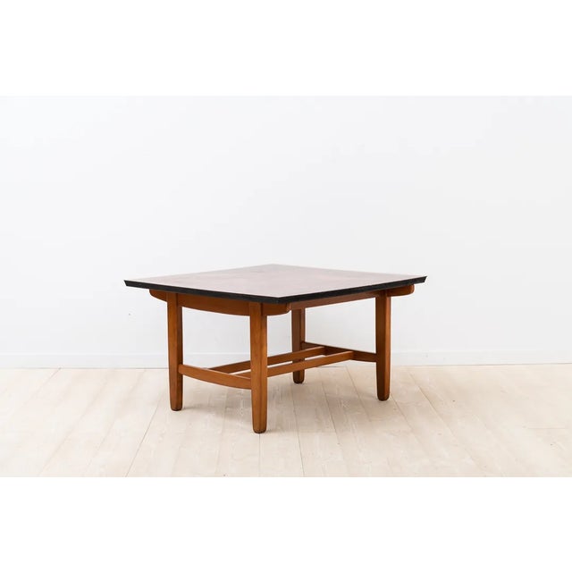 This coffee table from the Trivia series was designed by Algot Törneman for Nordiska Kompaniet in Nyköping, Sweden. It is...