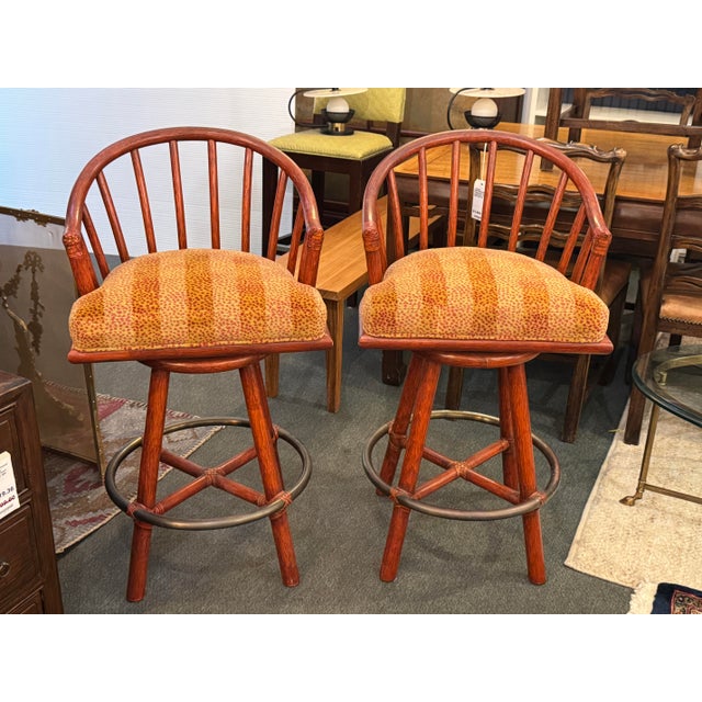 Design Plus Gallery presents a Pair of Curved Back Swivel Bar Stools from McGuire Furniture. These barstools have a rattan...
