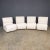 A set of four late-20th Century Italian seats, exquisitely reupholstered in lavish cream boucle fabric, offering a perfect...