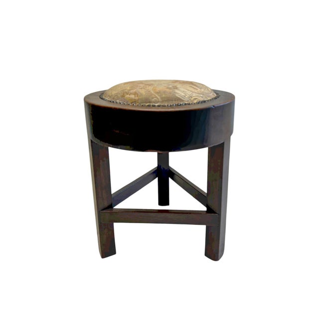 Antique wooden stool 1950s or earlier. Crafted from dark-stained wood and a round seat with the original upholstery and...