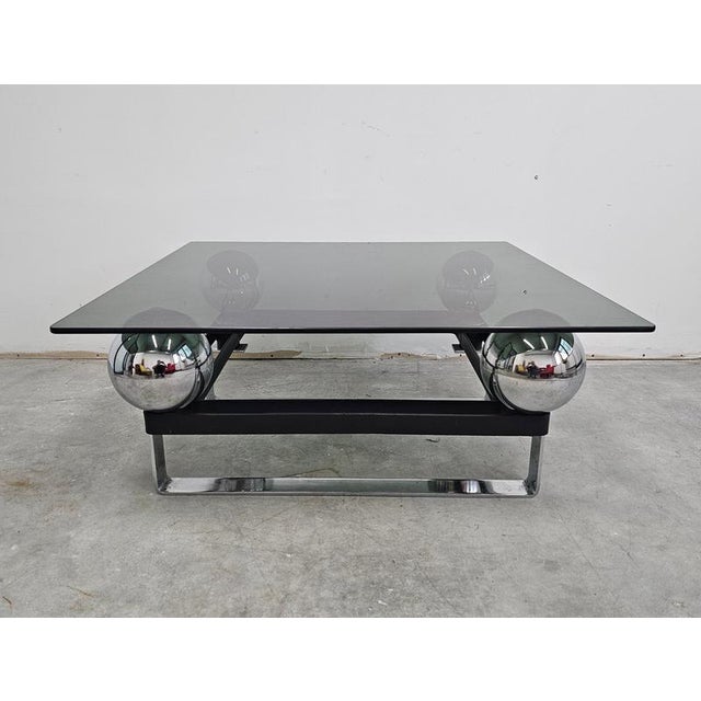 In this listing you will find a spectacular postmodern coffee or cocktail table done in chrome plated steel, with a tinted...