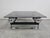 In this listing you will find a spectacular postmodern coffee or cocktail table done in chrome plated steel, with a tinted...