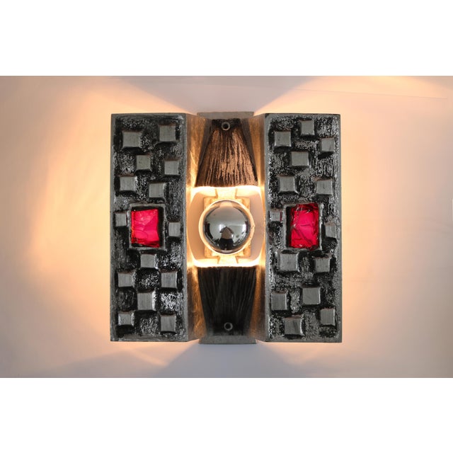 3 Brutalist Wall Lights Cast aluminum with red crackled glass "Light as Artwork" These sculptural elements are not just...