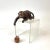 What a fun little guy! This ceramic monkey with a ceramic hanging basket peers over any flat surface. The metal chain...