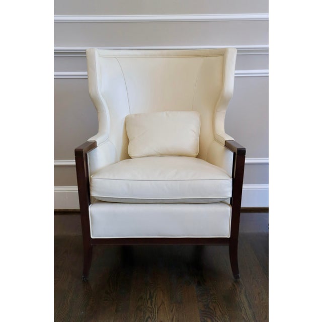Manor Wing Back chair for Baker Furniture. These ivory leather chairs with kidney pillows bring an elevated presence to...