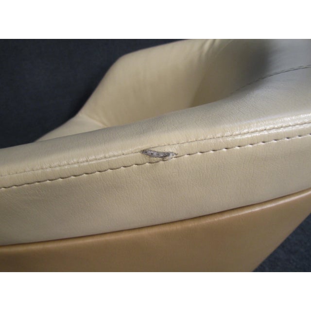 ( 2 ) Mid-Century Modern swivel tub armchairs. These lounge chairs are upholstered in stylish leather. Swivel bases give...