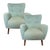A beautifully restored pair of mid-century modern lounge chairs featuring elegant sculptural lines, gently flared arms,...