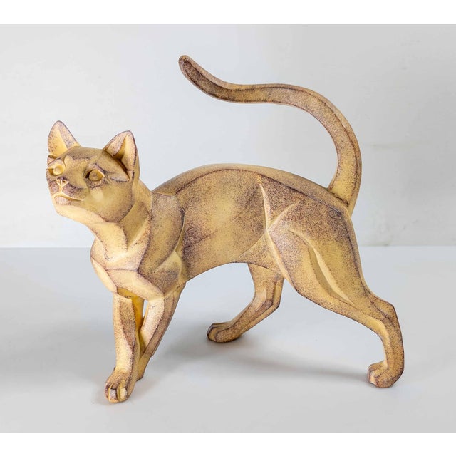 We are selling this charming cat sculpture or figure. This figure appears to be made out of molded composite or ceramic....